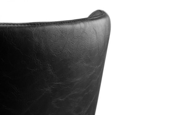 luxe black leather chair back corner